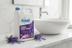 A 5-liter bottle of Bcleen Cream Hand Wash with Moisturizer, lavender scented, with a blue cap and a label featuring an image of lavender plants and a hand.