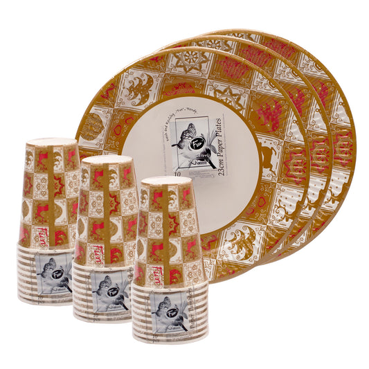 A set of paper plates and paper cups with a festive Christmas tree pattern.
